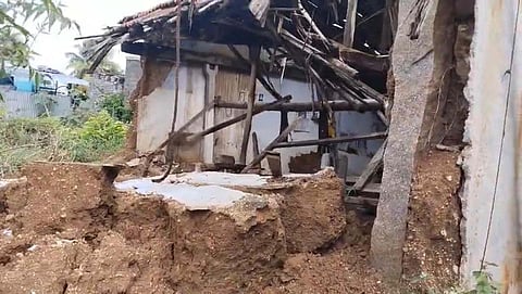 A side wall and tile roof of a house collapsed in Devanampalayam village. 