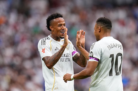 Real Madrid's Eder Militao, left, celebrates with Kylian Mbappe after scoring the opening goal during the Spanish La Liga soccer match between Real Madrid and Espanyol on September 20, 2025.