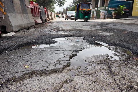 A damaged and unrepaired road on Hosur Road near Langford Town, Bangalore causing inconvenience to commuters.