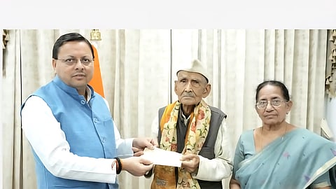 Rawat personally presented the cheque to Chief Minister Pushkar Singh Dhami at his residence on Saturday.
