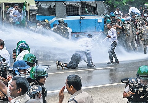 Water cannon used by police to stop BJD workers from breaking barricades and entering Assembly during the protest in Bhubaneswar 