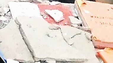  Concrete debris from the crash lying on the doctor’s table at the centre on Tuesday.