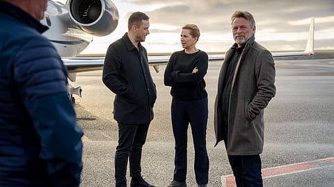 Chairman of the Naalakkersuisut Jens-Frederik Nielsen, centre left, welcomes Danish Prime Minister Mette Frederiksen, centre right, and her husband, Bo Tengberg, right, as they land at Nuuk airport in Greenland, on Tuesday, Sept. 23, 2025.