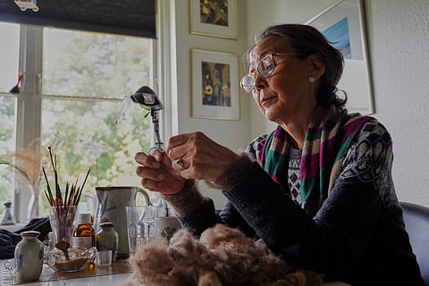 66-year-old retiree Kirstine Berthelsen prepares wool for sewing at her home in northern Copenhagen, Denmark, Sept. 17, 2025.