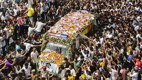 North East India Festival (NEIF) chief organiser Shyamkanu Mahanta and his manager Siddhartha Sharma, alleged to be involved in the death of legendary singer Zubin Garg in Singapore, are brought to the CID office inside a police vehicle following their arrest from Delhi, in Guwahti, Assam, Wednesday, Oct. 1, 2025.