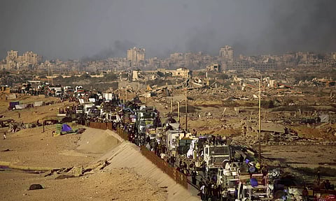 Displaced Palestinians move with their belongings southwards on a road in the Nuseirat refugee camp area in the central Gaza Strip on September 23, 2025, as Israel presses its ground offensive to capture Gaza City amidst the war against Hamas.