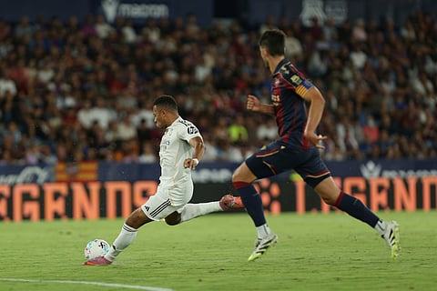 Real Madrid's Kylian Mbappe tries to score during a Spanish La Liga soccer match between Levante and Real Madrid at the Ciutat de Valencia stadium in Valencia, Spain, Tuesday, Sept. 23, 2025.