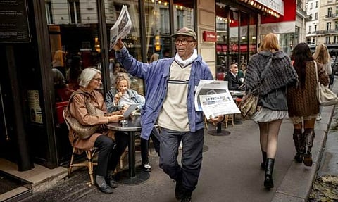 Paris’ last newspaper hawker, Ali Akbar, honoured by Macron for decades of spirited street selling