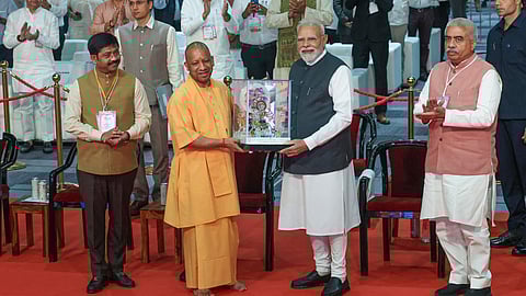Prime Minister Narendra Modi being felicitated by Uttar Pradesh Chief Minister Yogi Adityanath during the inauguration of Uttar Pradesh International Trade Show 2025, in Greater Noida, Gautam Buddha Nagar district.
