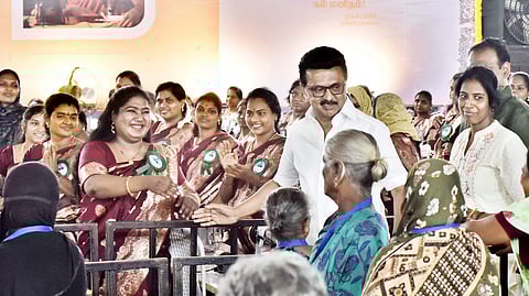Chief Minister MK Stalin interacts with the benificiaries after distributing the laptops, sewing mechines and spectacles to the elderly at a function held at his Kolathur Assembly Constituency, in Chennai on Wednesday .