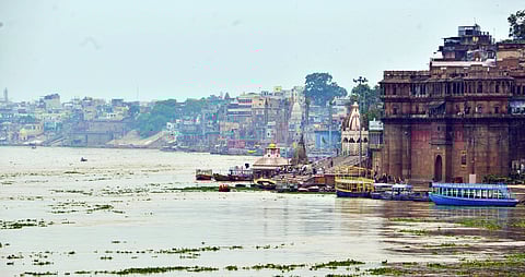 Boats remain anchored on the banks of Ganga River in Varanasi.