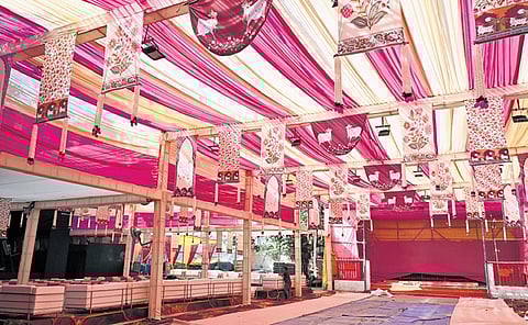 Preparations underway as workers construct a Durga Puja pandal at Timarpur on September 25, 2025 in New Delhi.