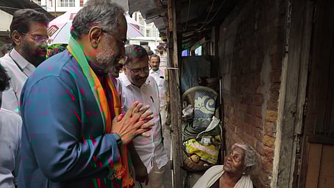 BJP state president Rajeev Chandrasekharan meets a family at Rajaji Nagar Colony in Thiruvananthapuram on Thursday.