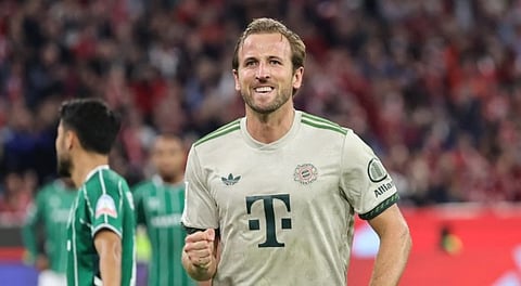 Bayern's Harry Kane celebrates after scoring his side's second goal during the German soccer cup match between Cologne and FC Bayern Munich in Cologne, Wednesday, Oct. 29, 2025.