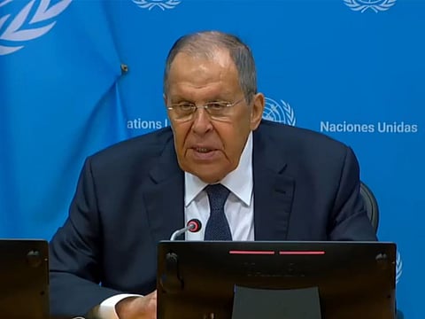 Rescue workers clear the rubble of a residential building destroyed by a Russian strike on Dnipro, Ukraine, Saturday, April 25, 2026. 
