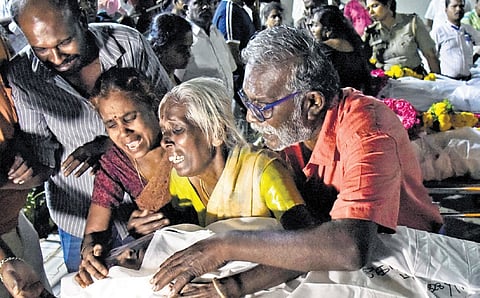 Family members of one of the stampede victims were wracked with grief as they received the body on Sunday 