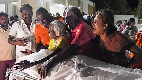Family members in Trichy mourn after receiving the body of a victim who died at a stampede at TVK leader Vijay’s campaign rally in Karur on Sunday, Sept. 28, 2025.