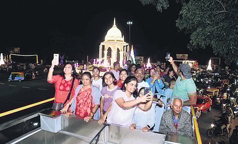 People enjoy their ride and click pictures on the upper deck of the Ambaari service in Mysuru on Sunday 
