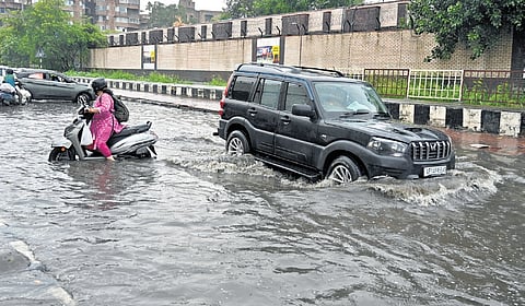 Waterlogged roads after heavy rainfall at NH24 Patparganj and ITO area on Tuesday; weather department sounds an orange alert for national capital.