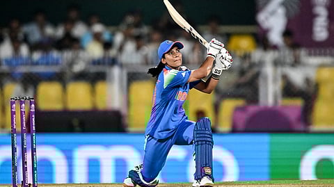 India's Amanjot Kaur watches the ball after playing a shot during the 2025 ICC Women's Cricket World Cup ODI match between India and Sri Lanka at the Barsapara Cricket Stadium in Guwahati on September 30, 2025.