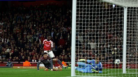 Arsenal's Bukayo Saka scores the team's second goal during the UEFA Champions League, league phase football match between Arsenal and Olympiacos at the Emirates Stadium in north London on October 1, 2025.