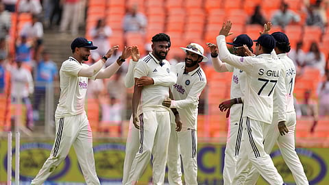 India's Mohammed Siraj, center, celebrates with teammates after the dismissal of West Indies' Brandon King.