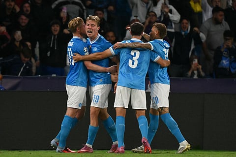 Napoli's Rasmus Hojlund (2ndL) celebrates with teammates after scoring his team's second goal during the UEFA Champions League phase 2 football match between Napoli and Sporting Lisbon on October 1, 2025.