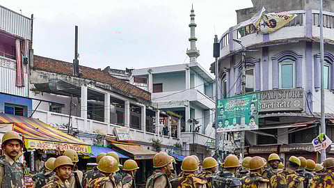Police personnel patrol a sensitive area during Friday prayers, a week after the Bareilly violence. 