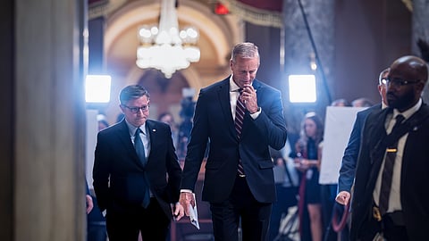 Speaker of the House Mike Johnson, R-La., left, and Senate Majority Leader John Thune, R-S.D., return to their offices after meeting with reporters on the third day of the US government shutdown, at the Capitol in Washington, Friday, Oct. 3, 2025.