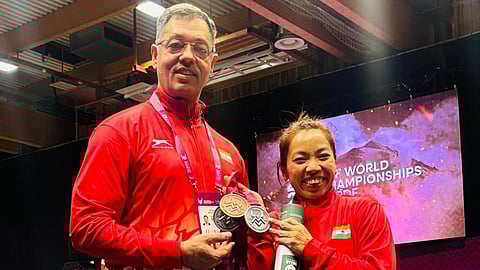 Mirabai Chanu celebrates her podium finish with head coach Vijay Sharma