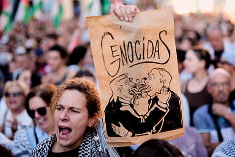 Pro-Palestinian demonstrators protest in Madrid, Spain, Thursday, Oct. 2, 2025, in solidarity with the Global Sumud Flotilla after ships were intercepted by the Israeli navy.