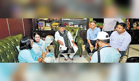 Deputy CM D K Shivakumar fields queries from enumerators of Socio-Economic and Educational Survey at his residence in Sadashivanagar, Bengaluru, on Saturday.