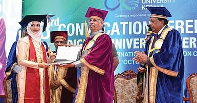 Governor Rajendra Arlekar felicitating a student at the convocation ceremony at Digital University Kerala in Thiruvananthapuram on Monday 