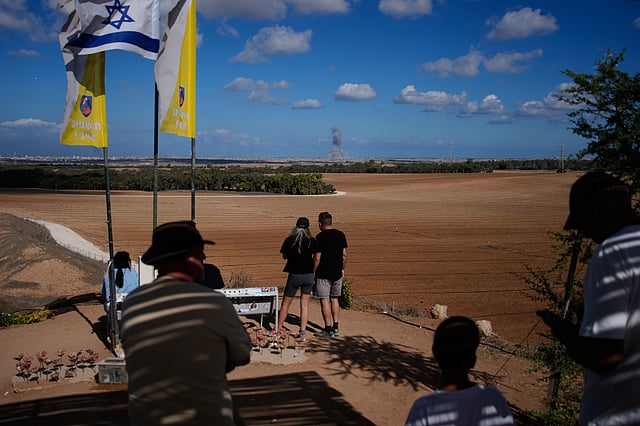 Smoke rises from an Israeli army bombardment in the Gaza Strip, seen from a memorial site for Israelis killed in the Oct. 7, 2023, Hamas attack, as Israel marks the second anniversary since the attack, Tuesday, Oct. 7, 2025.