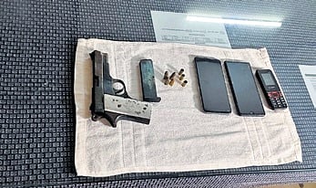 Police seized a country-made pistol, one magazine, four live ammunition, three blank cartridges and as many mobile phones from their possession.
