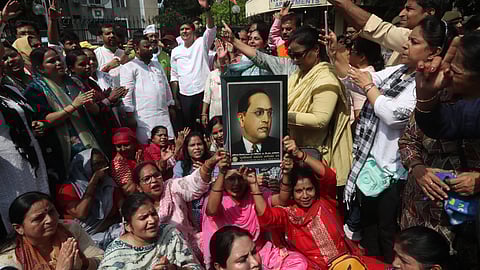 AAP members protest outside Adv. Rakesh Kishores residence at Mayur Vihar in New Delhi on Tuesday.