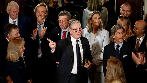 British Prime Minister Keir Starmer, center, speaks with business leaders at the Taj Mahal Palace in Mumbai, India Wednesday, Oct. 8, 2025.
