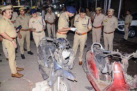 Police personnel investigate the spot after an explosion in Mishri Bazar area, in Kanpur, Uttar Pradesh, Wednesday, Oct. 8, 2025.