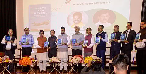 Caption: Union Civil Aviation Minister Ram Mohan Naidu with DIG, CISF, Shiv Kumar Mohan in Delhi during an event to mark the launch of the latter's book, 'Above and Beyond - Exploring the amazing world of Aviation'.