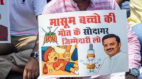 Members of National Students Union of India (NSUI) stage a protest over the death of children in Chhindwara due to suspected renal failure, allegedly caused by consumption of a cough syrup, at party office in Bhopal, Sunday, Oct. 5, 2025. 