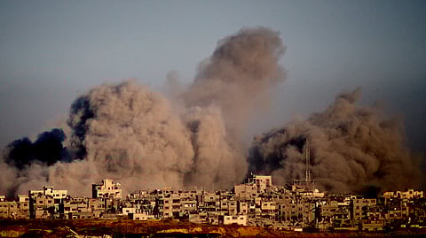 Smoke rises to the sky following an Israeli military strike in the northern Gaza Strip, as seen from southern Israel, Wednesday, Oct. 8, 2025.
