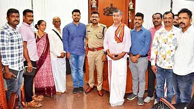 Ananthakrishna Prabhu (fifth from left) reunited with his family by the police in Udupi on Wednesday 