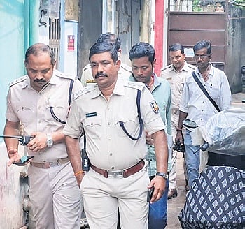Police conducting raids at Hatipokhari locality in Cuttack on Thursday.