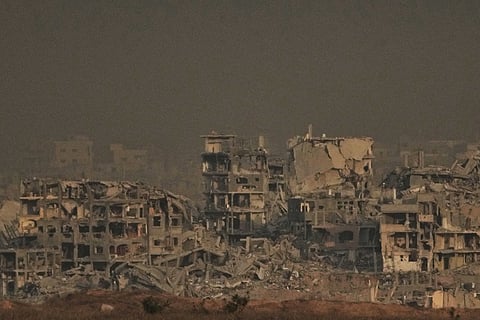 Displaced Palestinians walk along the coastal road near Wadi Gaza in the central Gaza Strip, moving toward northern Gaza, Friday, Oct. 10, 2025, after Israel and Hamas have agreed to a pause in their war and the release of the remaining hostages.