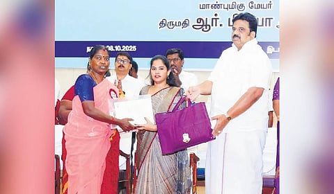 Mayor R Priya distributing appointment orders to ragpickers and their family members on Wednesday.