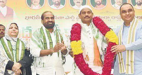 Syed Basha takes oath as State Minority Morcha president at Vijayawada.