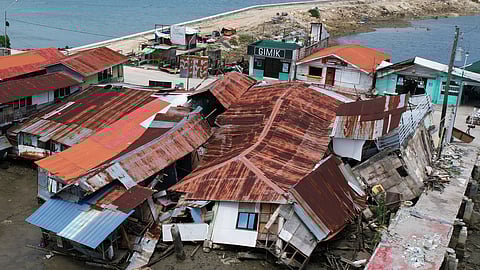 Business establishments that were damaged due to a recent strong earthquake lie in Bogo city pier, Cebu Province, Central Philippines, Friday, Oct. 3, 2025. 