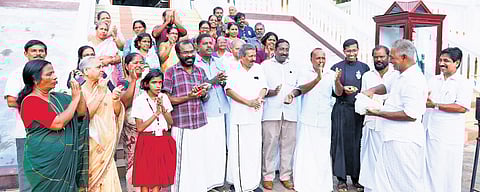 Munambam residents celebrate the HC verdict by sharing sweets on the premises of Kadappuram Velankanni Matha Church