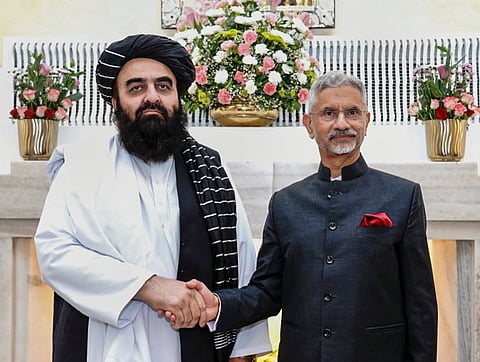 Taliban foreign minister Amir Khan Muttaqi (R) with Indian External Affairs Minister S Jaishankar