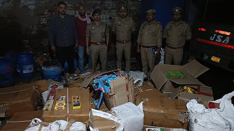 Police with the seized illegal firecrackers worth over Rs 50 lakh.